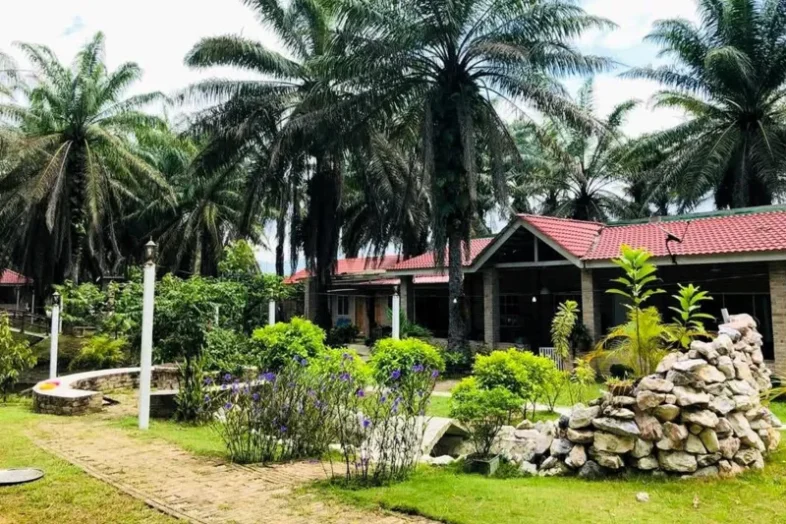xterior view of the Gopeng Youth Retirement Home in Perak, Malaysia, featuring a peaceful eight-acre nature compound with greenery.